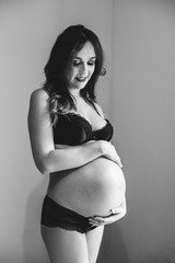 pregnant woman in black underwear