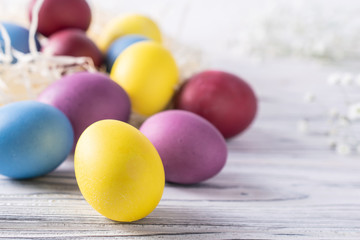 Fototapeta na wymiar Happy easter colorful dyed eggs close up, macro