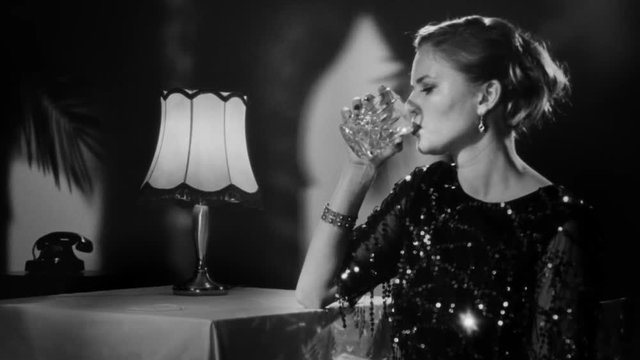 Elegant blonde woman beautifully looking into the camera