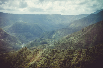 Naklejka premium Aerial view of typical peaks near Napali Coast in Kauai, US