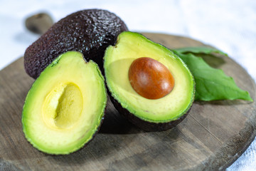 Two ripe raw hass avocados close up