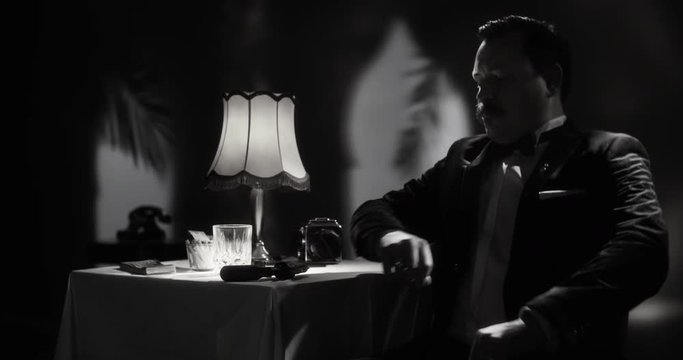 Well dressed author sitting down while collecting thoughts