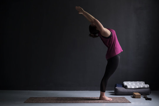 European Woman On A Yoga Mat Doing The Upward Salute Pose.