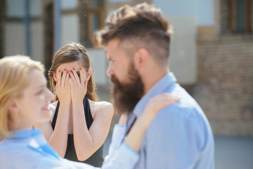 Jealous of their love. Jealous girl look at couple in love on street. Bearded man cheating his woman with another girlfriend. Unhappy woman feeling jealous. Romantic couple of man and woman dating