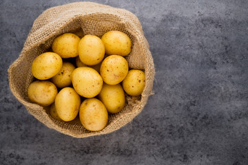 A bio russet potato wooden vintage background.