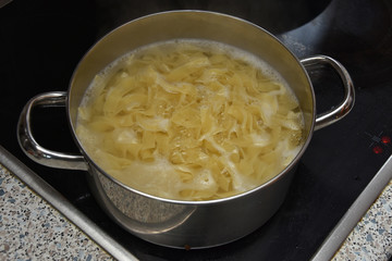 Ribbon pasta in boiling water