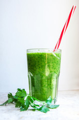 Green cocktails with parsley and straws for drinking (warm tone)	
