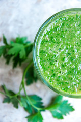 Green cocktails with parsley and straws for drinking (warm tone)	
