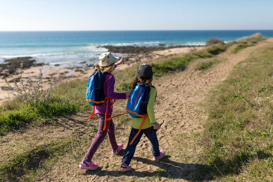 Two young girls exploring Spanish coastline, Playa Zahora, Andaluc&iacute;a, Spain