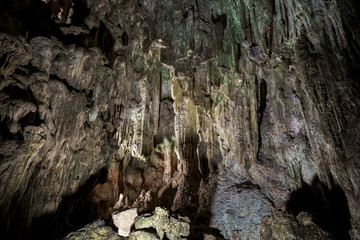 Cave deep dark inside. Underground of stone rock mountain. Ha Long Vietnam nature background