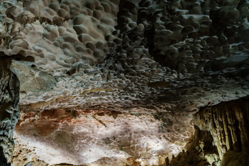 Cave deep dark inside. Underground of stone rock mountain. Ha Long Vietnam nature background