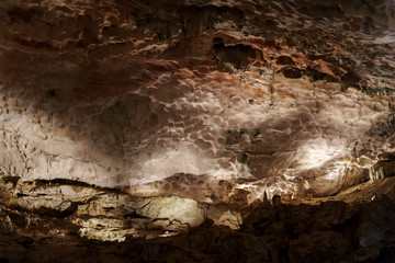 Cave deep dark inside. Underground of stone rock mountain. Ha Long Vietnam nature background