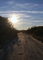 Gravel road at sunset.