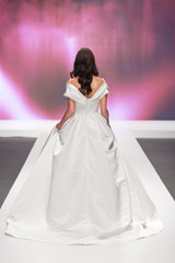 Bride walking away in a wedding dress