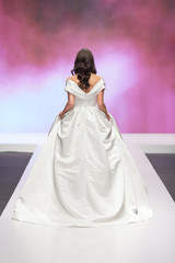 Bride walking away in a wedding dress