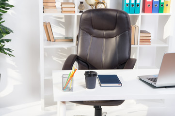 office interior. table in modern office interior. empty interior design. office life. interior of office building. modern design with no people. Conference room with laptop, coffe and note on table