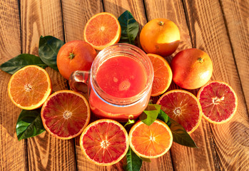 Blood Oranges Juice With Fresh Fruit On Wooden Background.Outdoor Shot In The Sunshine