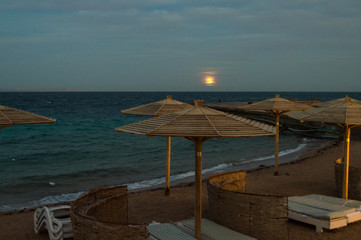 sunset beach umbrellas horizon