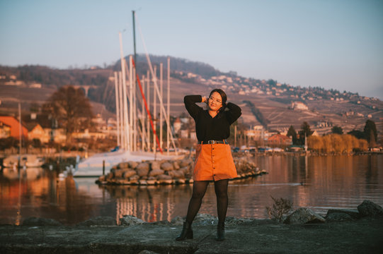 Outdoor portrait of asian plus size model posing by the lake
