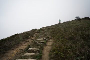 Person walking down mountain stairs