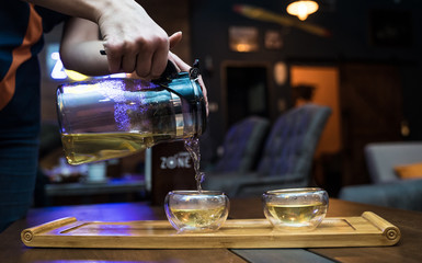 waiter serving red wine in restaurant
