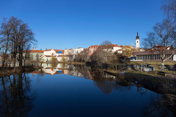 Sunny winter royal medieval Town Pisek with the Castle above the river Otava, Czech Republic 