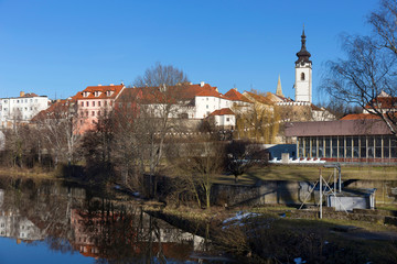 Sunny winter royal medieval Town Pisek with the Castle above the river Otava, Czech Republic 