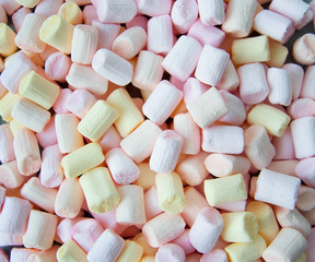 Colorful marshmallows as background, macro. Fluffy marshmallows texture close up.