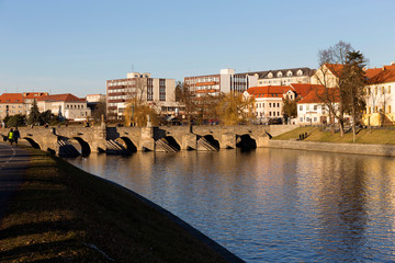 Obraz premium Sunny winter oldest stone bridge in central Europe above River Otava, Pisek, Czech Republic