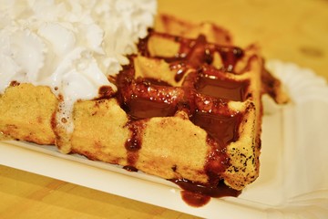 Vegan Belgian waffles with soy whipped cream and chocolate sauce in Brussels 