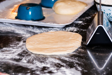 Italian food preparation called Calzone, wheat flour, kneading, Italian tradition.