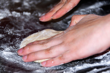 Fototapeta premium Italian food preparation called Calzone, wheat flour, kneading, Italian tradition.