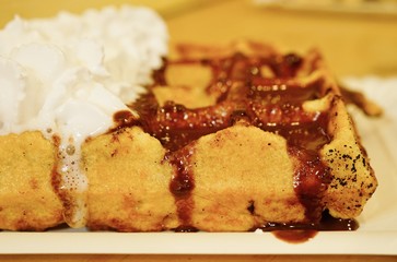 Vegan Belgian waffles with soy whipped cream and chocolate sauce in Brussels 