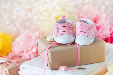 Its a girl, pink theme Baby Shower. Close-up of baby shoes