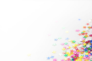 Frame made of colored confetti. White background