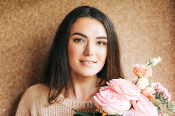 Close up portrait of beautiful woman  holding flowers