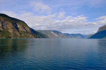 Naklejka premium Norway Nature Fjord, Summer Sognefjord. Sunny Day, Landscape With Mountain, Pure Water Lake, Pond, Sea