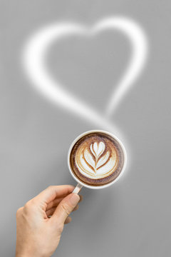 Woman's hands holding a cup of coffee