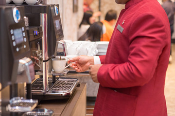 Man using a coffee machine