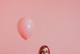 Pink haired girl with a balloon