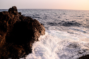 Strong Waves Crashing on the Volcanic Coast