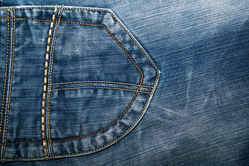 Shabby denim texture for background. Blue jeans .Patch stitched pocket