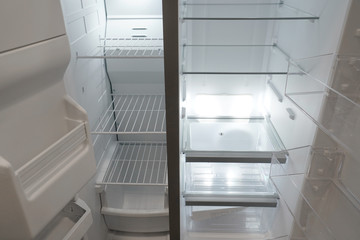 close up on empty refrigerator with door open
