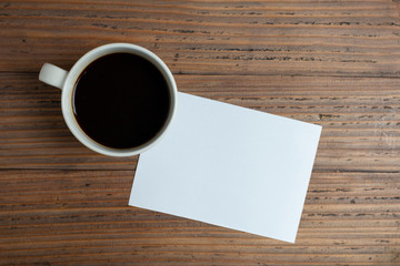Obraz na płótnie Canvas coffee cup and white letter paper.