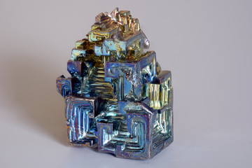 Isolated colorful synthetically synthesized bismuth crystal as a representation of the chemical element in the periodic table of elements