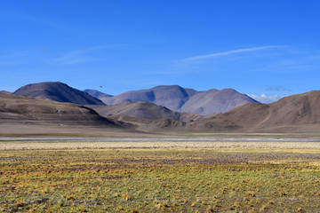 China, the structure of the Tibetan mountains on the way to lake Mershung in summer in sunny day