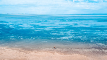 Person and Lake Landscape. Aerial View to show the vastness of the lake