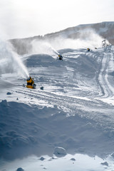 Snow cannons on snowy mountain slope in Utah