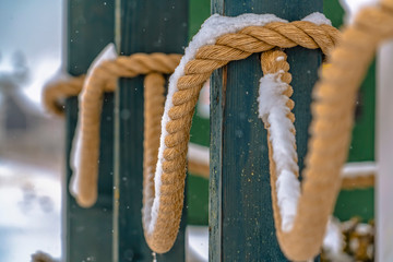 Snow on the rope of a fence in Daybreak Utah