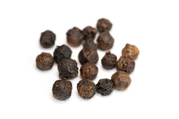 image of black pepper seeds on white background. Food.